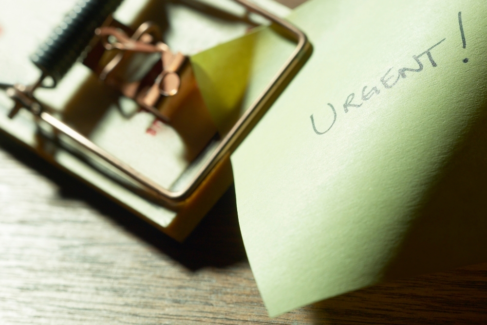 A paper note written urgent on top