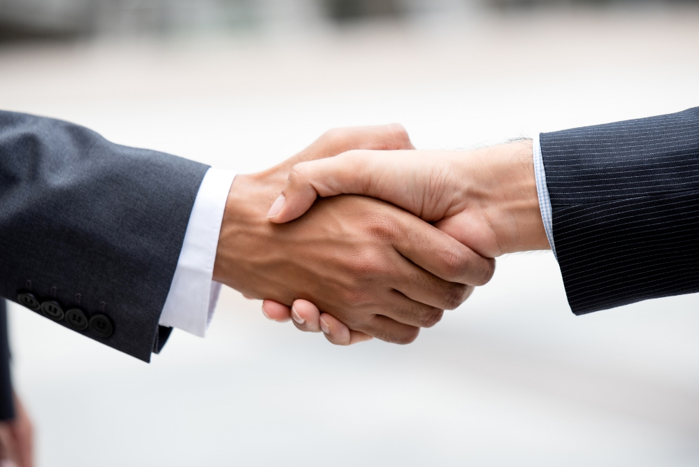 Two people shaking hands
