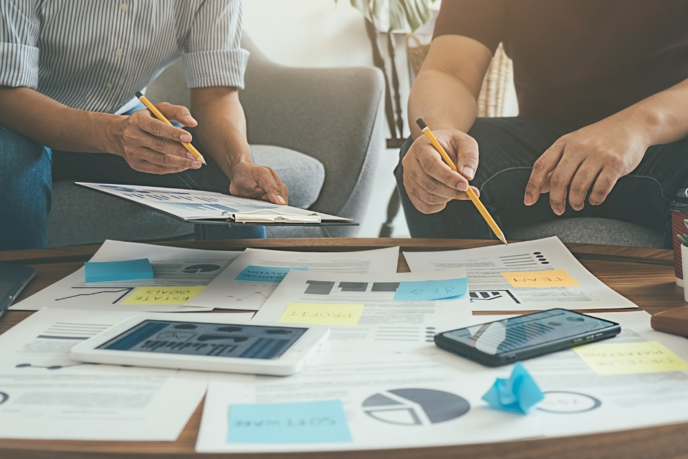 people discussing with each other with graphs