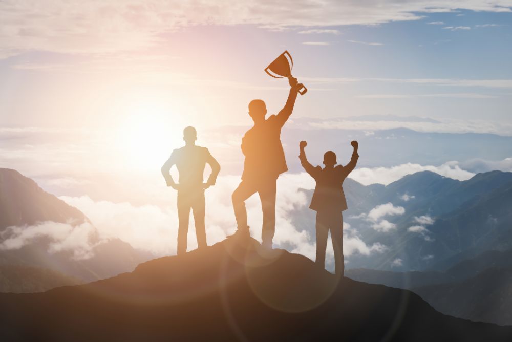 Individuals celebrating an achievement with a trophy, the image denotes right goals.