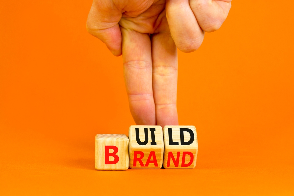 Block which says build and brand