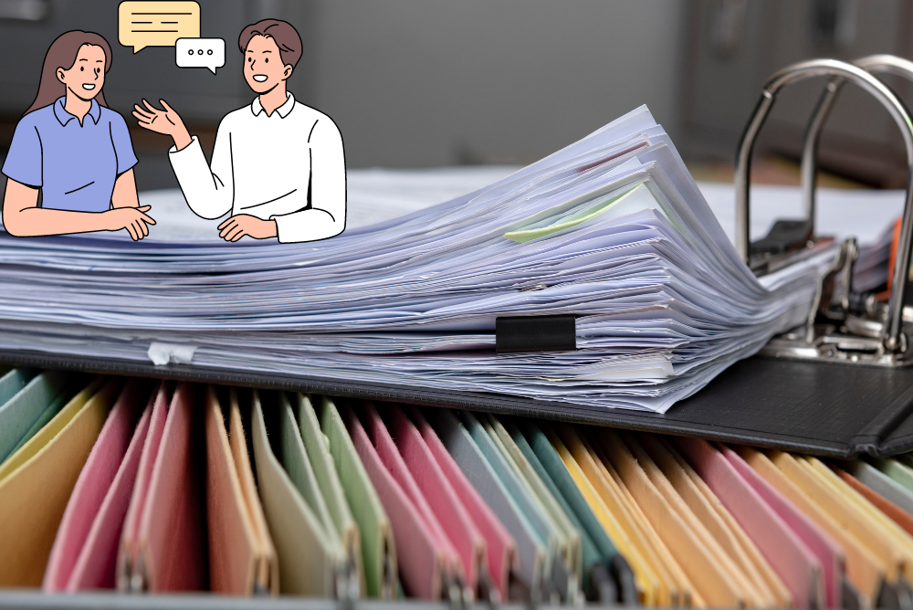 An image with two people talking, with files and documents around them