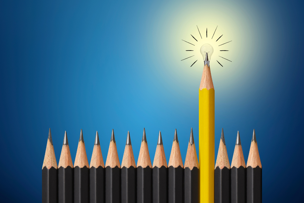 Lighted colour pencil among black non lighted one