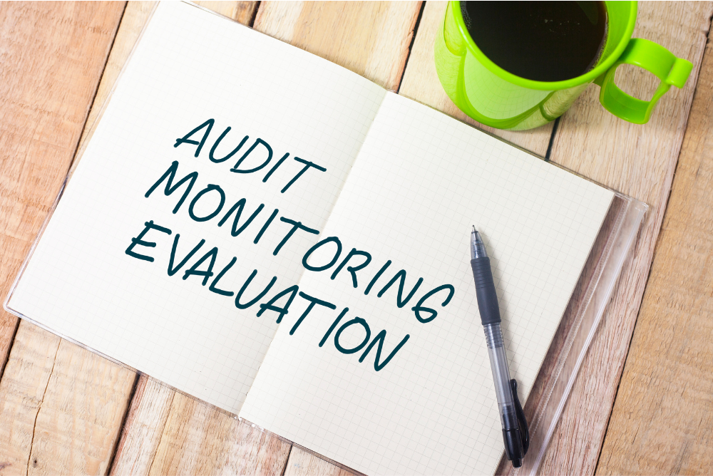 Audit, Monitoring and Evalution Written on Paper