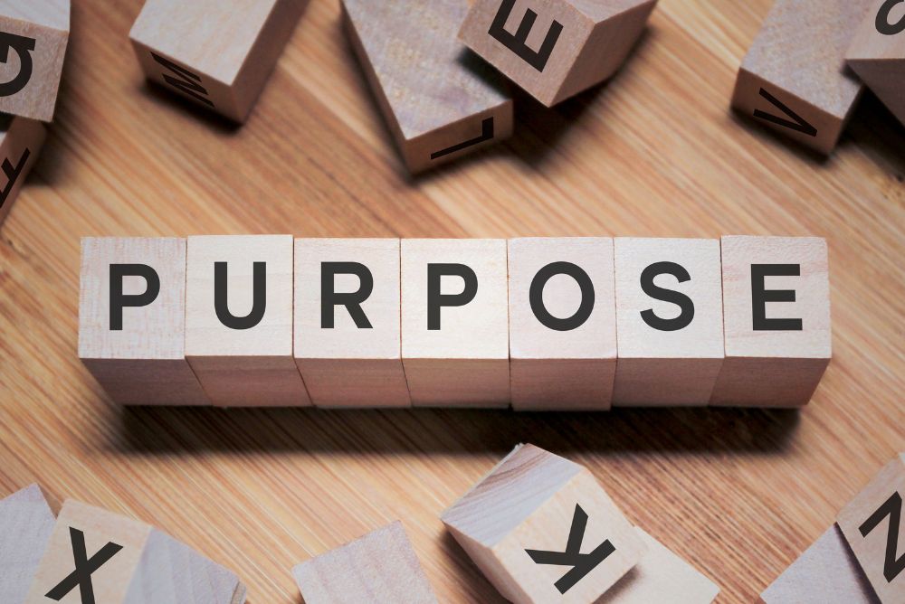 Wood letter blocks which says "PURPOSE"