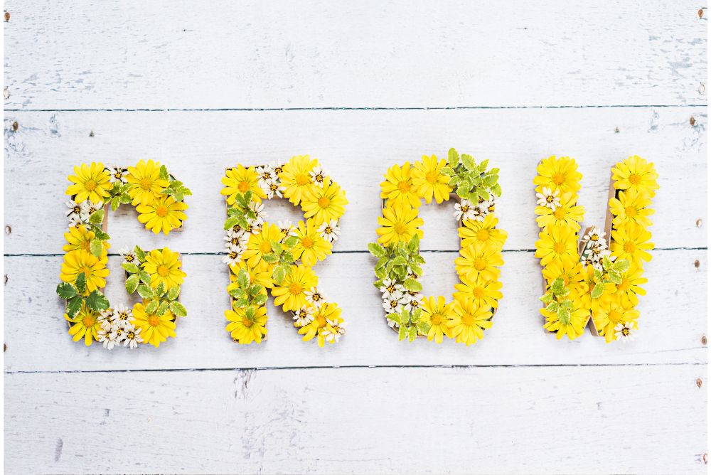 Grow word spell out with Flowers