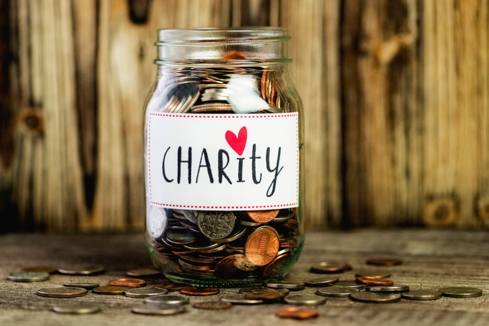A jar which is labelled as charity