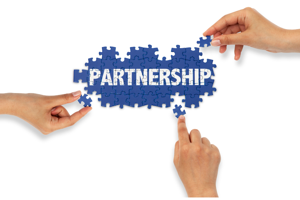 Puzzle Pieces Coming Together To Spell Partnership