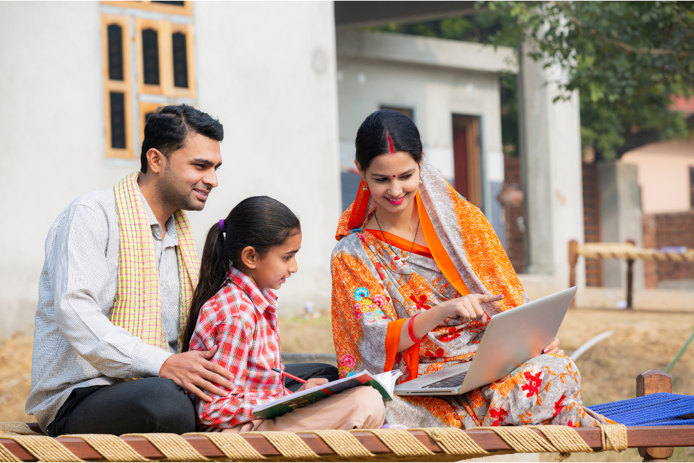 Village Couple teaching from Laptop