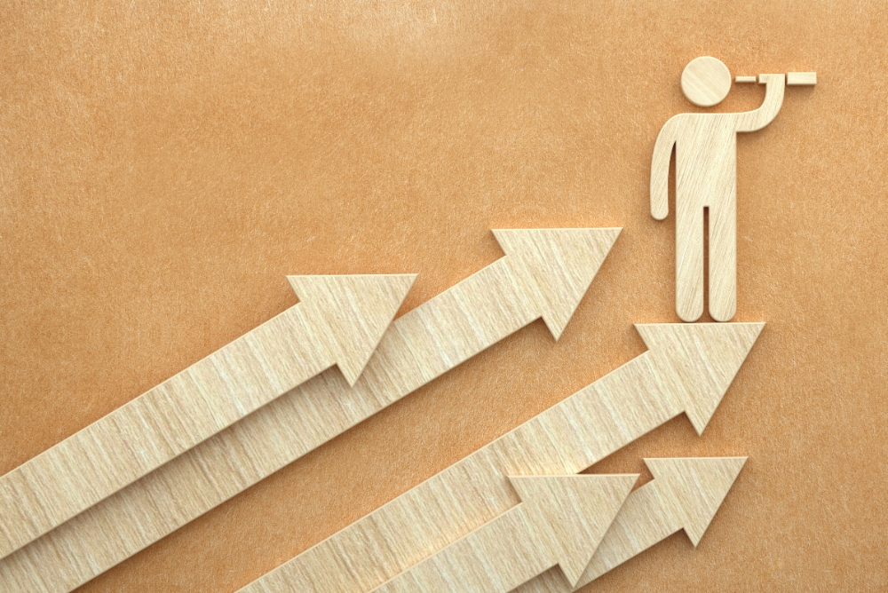 paper arrows pointing to a person with a watch glass